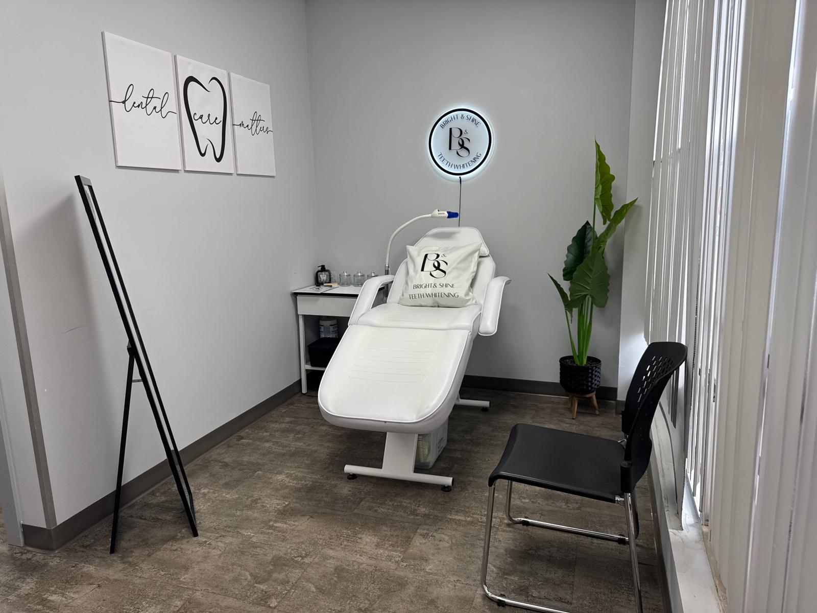 Inside a Bright & Shine Teeth Whitening treatment room, with a whitening chair, LED lamp, and branded décor